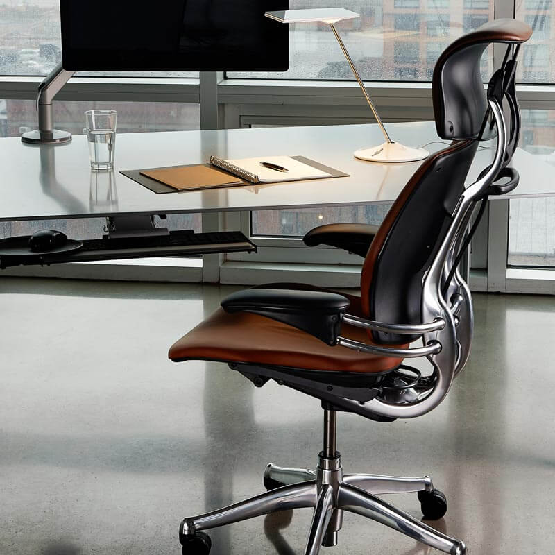 humanscale freedom task chair with headrest behind standing desk