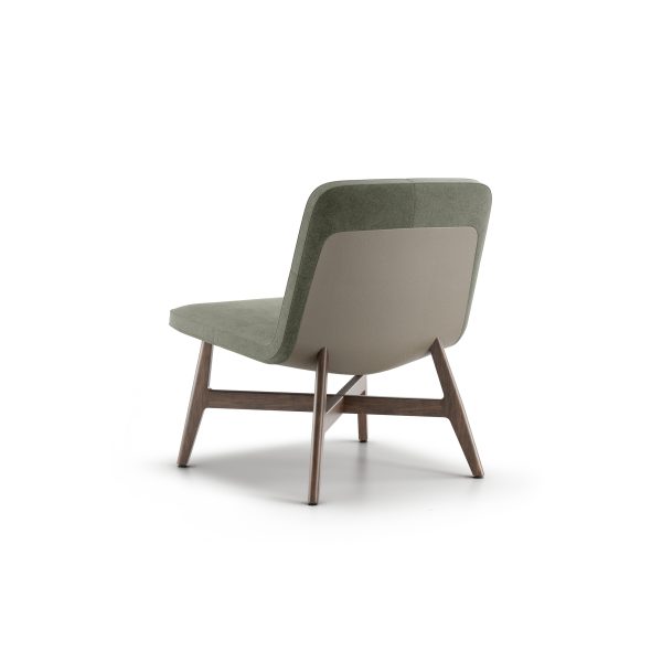 swav 94001 leftback scaled <p>the swav armless lounge chair is an exploration of minimalism and lightness. the body of the chair is somewhat abstract, balancing on a refined, simple wooden structure. light shines through and under this lounge piece, giving the impression that the seat is gracefully floating above the frame.</p>