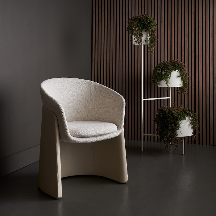 davis furniture seba chair in cream fabric next to plants