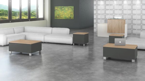 maverick desk cube occasional tables in an office space with a white sofa. tables are in light gray and desert walnut tops